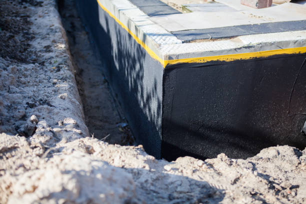 Professional Basement Waterproofing technician working in Harleysville, PA